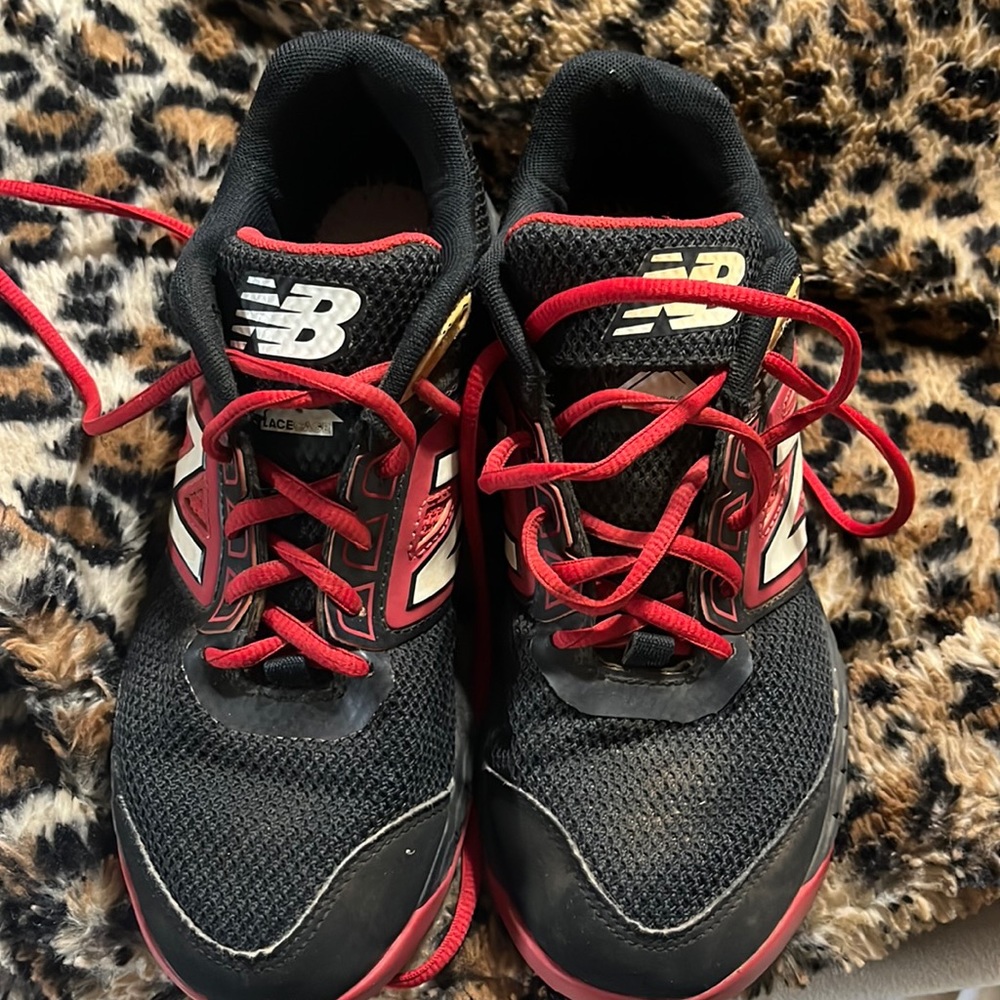 GU New Balance turf shoes